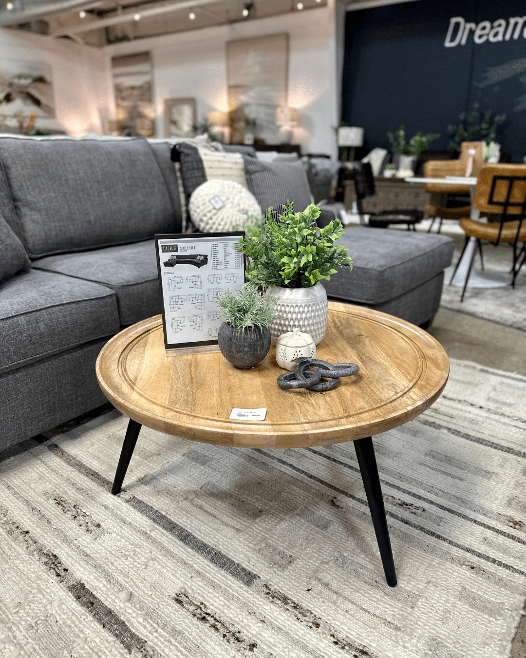 round wood coffee table with black legs